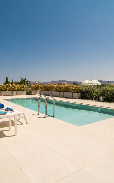 Iris: Building Exterior, Garden, Outdoor, Pool