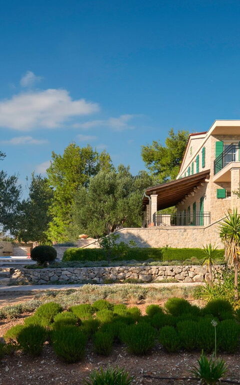 Orvas Villa 189: Building Exterior, Garden