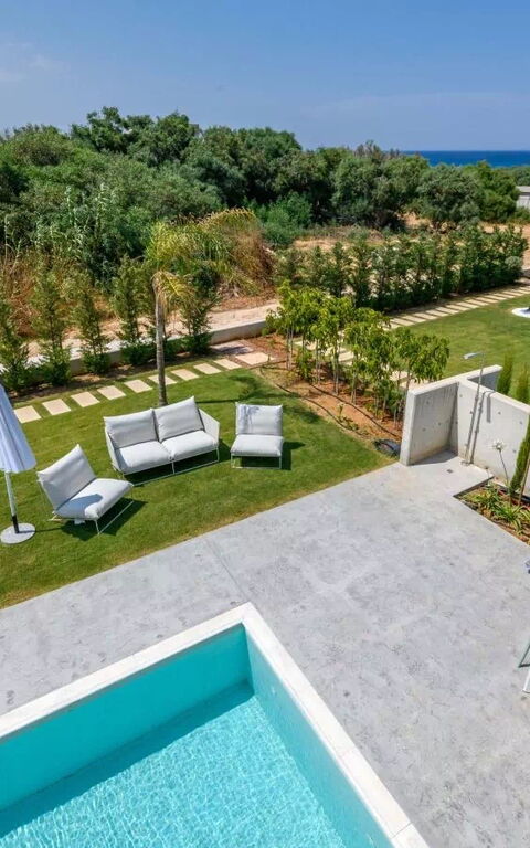 By the Beach - Blue Topaz Villa: Building Exterior, Garden, Outdoor, Pool