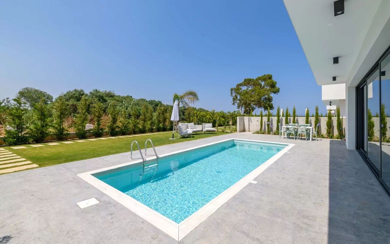 By the Beach - Blue Topaz Villa: Building Exterior, Garden, Outdoor, Pool